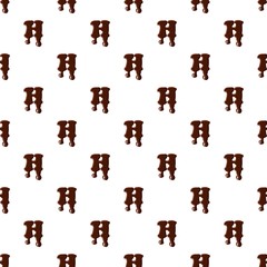 Letter H from latin alphabet with numbers and symbols made of dark melted chocolate