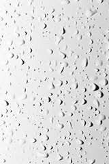 Drops of water with shadow on white background