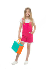 Kids designer clothing summer sale. Girl cute teenager carries shopping bag. Kid bought clothing summer sale. Sale benefits. Seasonal sale concept. Girls absolutely fond of shopping