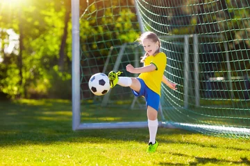 Foto op Plexiglas Brazil football fan kids. Children play soccer. © famveldman
