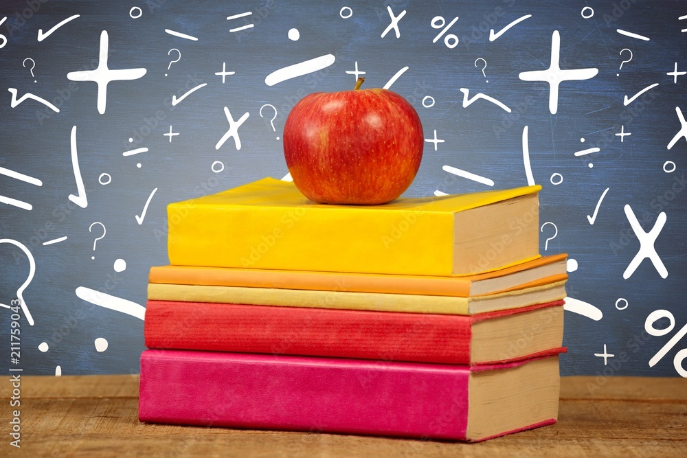 Poster composite image of apple with books on table