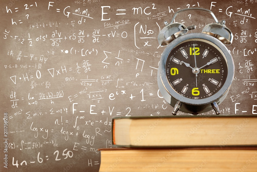 Aufkleber composite image of alarm clock placed on stack of books