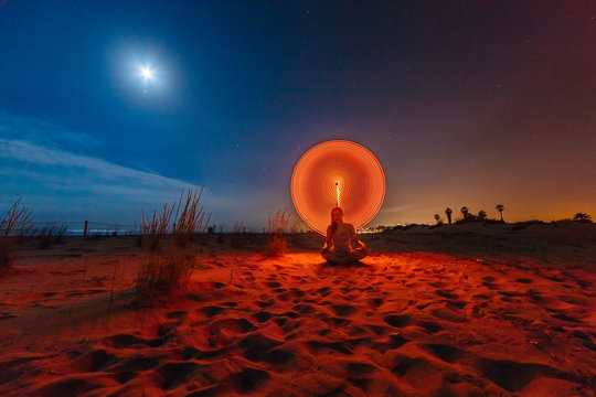Silhouette of woman with colored lights