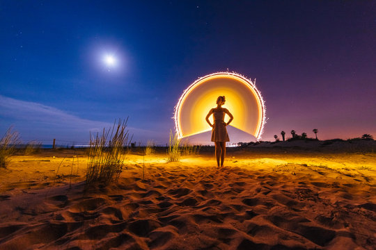 Silhouette of woman with colored lights