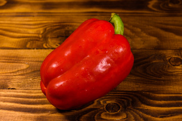 Red bulgarian pepper on a wooden table