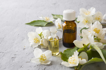 Fototapeta na wymiar Oil of jasmine. Aromatherapy with jasmine oil. Jasmine flowers