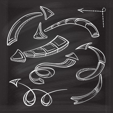 Vector hand drawn arrows icons set on chalkboard