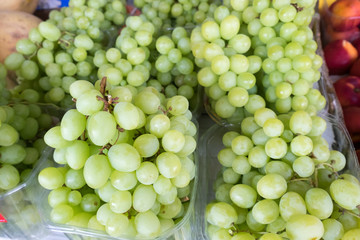 Macro shot of new harvest green-yellow grapes for sale at local farmers market