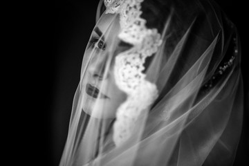 Mysterious portrait of a bride hidden under the veil