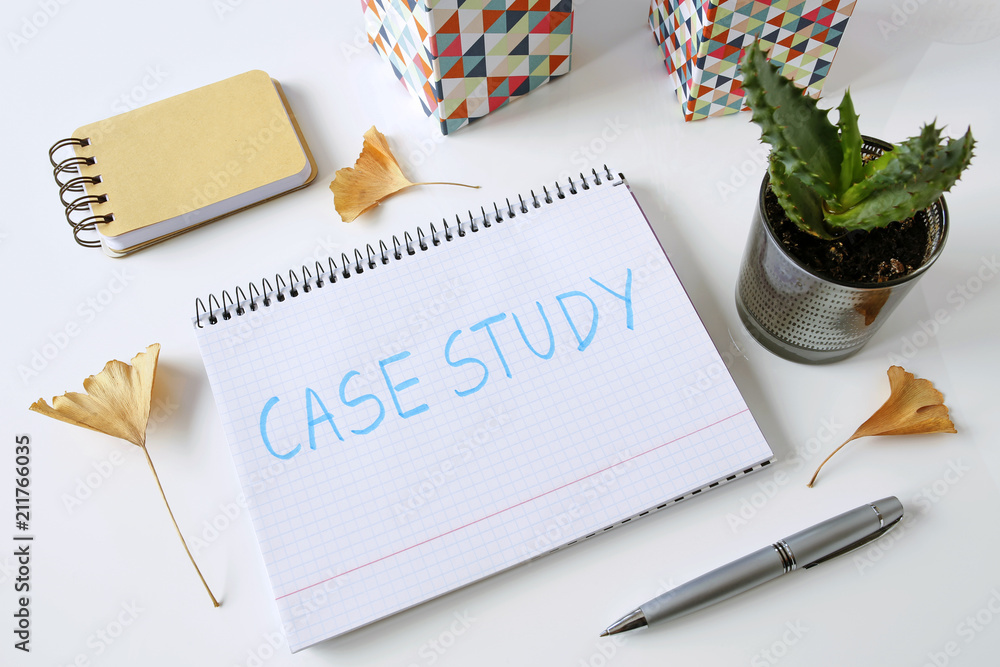 Poster case study written in a notebook on white table