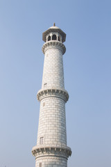 Tower of Taj Mahal on the blue sky background, Agra, India