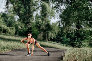 Young sportswoman stretching and preparing to run. Sport Lifestyle.