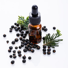 juniper essential oil on a white background