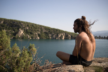 Man sitting on a cliff