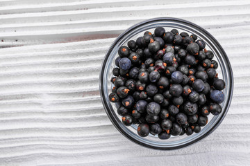 dried juniper berries on a white background