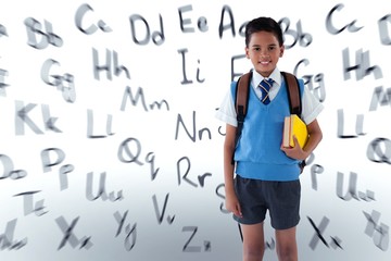 Composite image of portrait of schoolboy with schoolbag holding