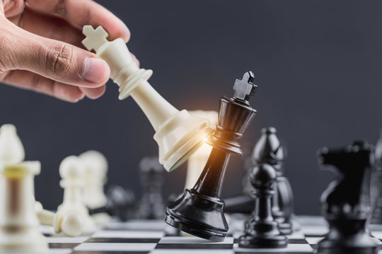The King in battle chess game stand on chessboard Concept for company strategy,business victory or decision the path to success.