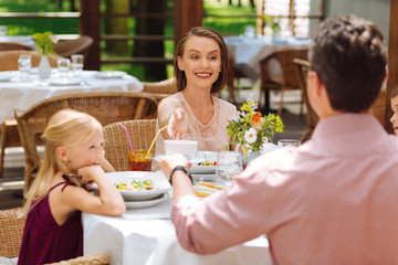 Happy parents. Two happy beaming parents feeling memorable while celebrating birthday of their little daughter