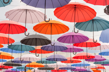 Fototapeta na wymiar Multicolored umbrellas, colorful background