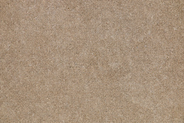 Brown concrete floor texture with small dash pattern. Close-up of speckled grunge background