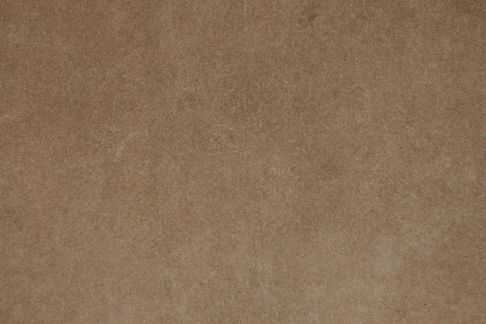 Brown concrete wall with fine grain texture. Photo of vintage plain background. Horizontal orientation