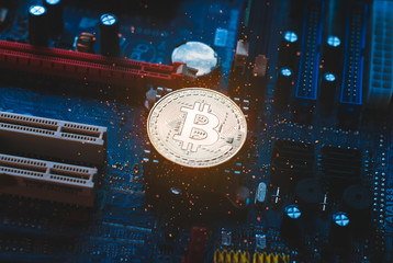 Bitcoin in the motherboard, virtual Currency against the background of PCB,