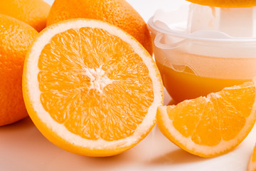 oranges and juice on a white background