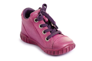 Children's pink shoe on a white background isolation