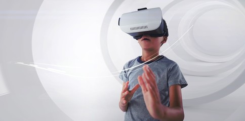 Boy gesturing while using virtual reality headset