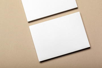 Blank paper pieces for mock up on a beige background