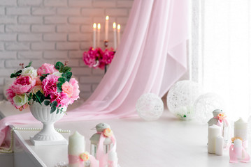 Beautiful decor of candles and flowers. White Pink shades.