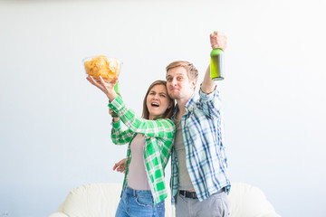 Soccer world cup concept - Young friends drink beer and cheering for football
