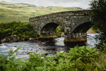 Fototapeta na wymiar Stone bridge over a scotish creek