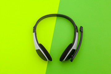 audio headset on color background