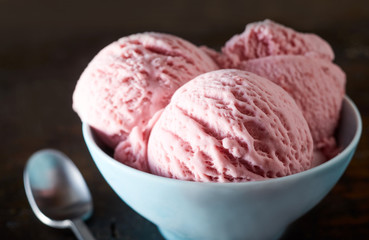 Bowl with tasty strawberry ice-cream dessert