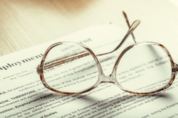 Close up shot of Eyeglasses  on document papers business concept