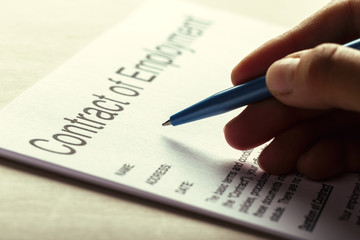 Close up shot of Eyeglasses  on contract document papers business concept