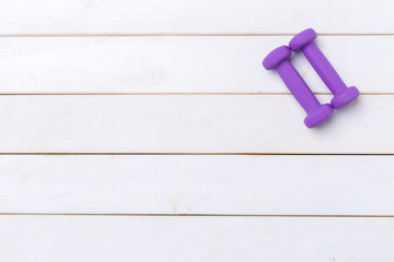 dumbells on wooden floor