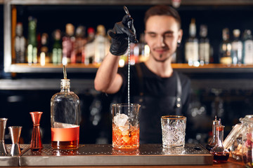 Cocktail Bar. Bartender Making Cocktails At Bar Counter