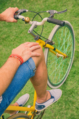 Obraz premium Attractive man sitting on old bicycle outdoors.