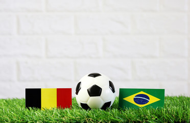 ball with Belgium VS Brazil flag match on Green grass football 2018