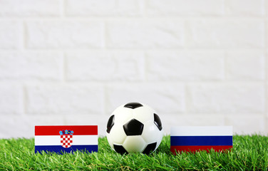 ball with Croatian VS Russia flag match on Green grass football 2018