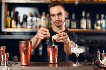 Cocktail Bar. Bartender Making Cocktails At Bar Counter