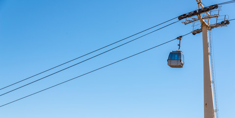 cableway against the sky, transport at height and tourist attraction