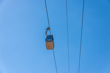 cableway against the sky, transport at height and tourist attraction