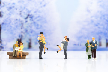 Miniature people: Couple show each other to show love, travel together . Image use for Valentine's day concept.