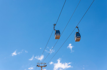 cableway against the sky, transport at height and tourist attraction
