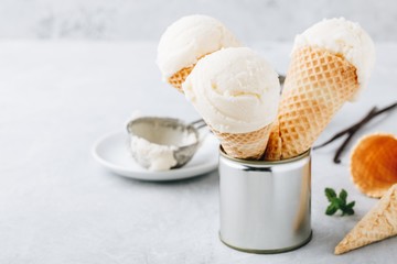 Fototapeta na wymiar Homemade Vanilla Ice Cream scoop in waffle cones