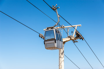 cableway against the sky, transport at height and tourist attraction