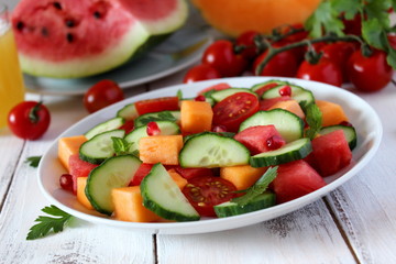 Fresh salad with fruits and vegetables. Top view with copy space.